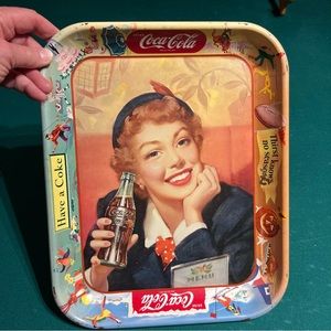 Vintage 1950s Coca-Cola metal serving tray features”thirst knows no season”
